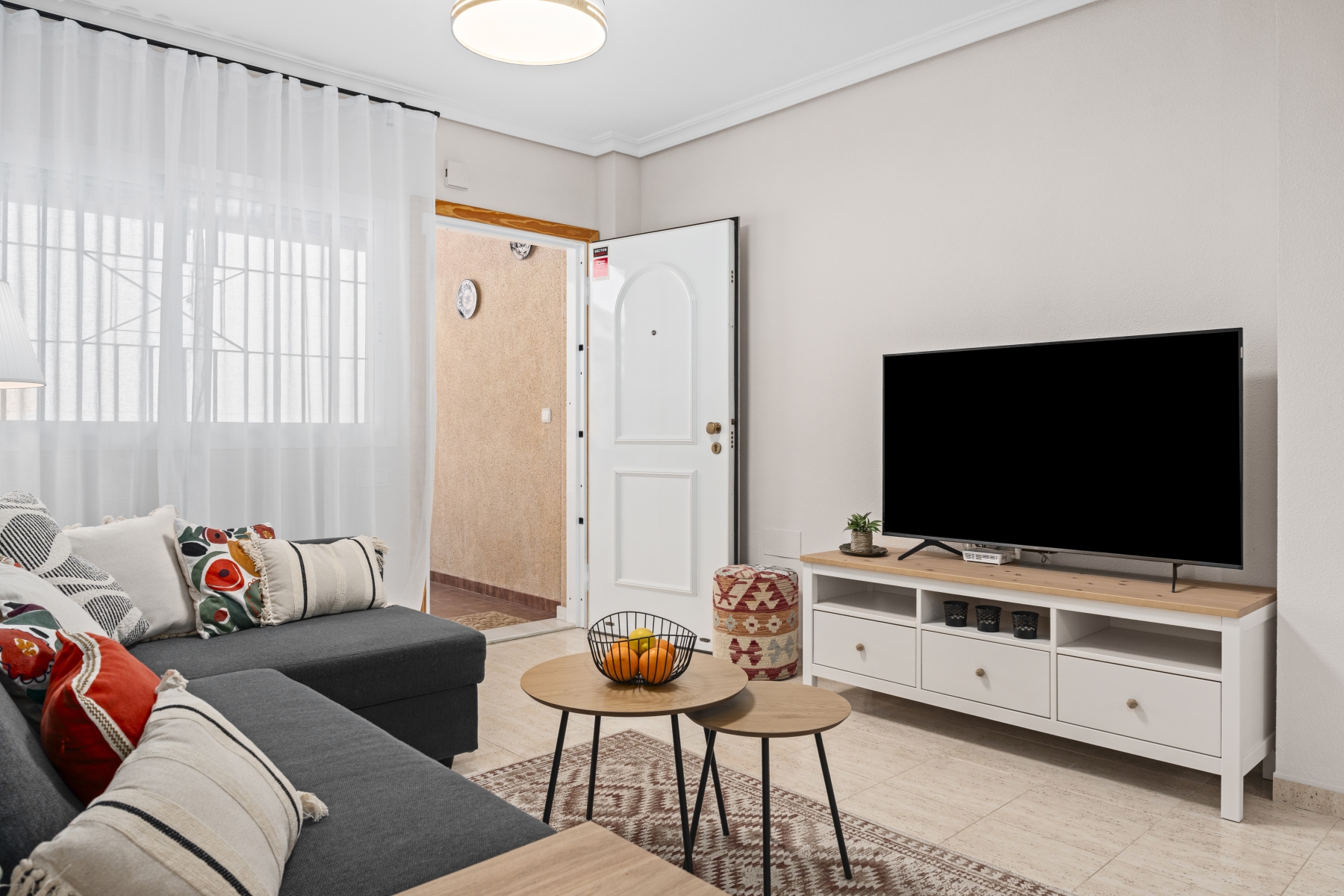 Living room entrance with TV